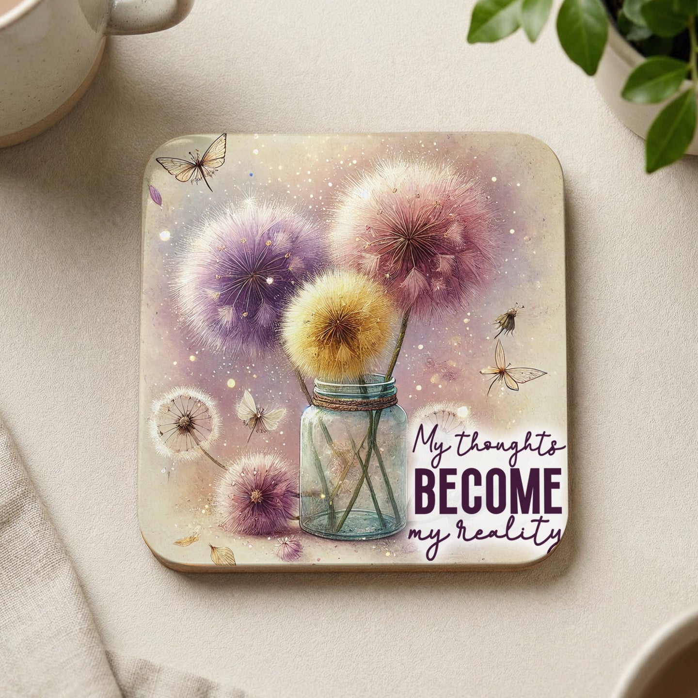 Coaster with dandelions, butterflies, and text "My thoughts become my reality".