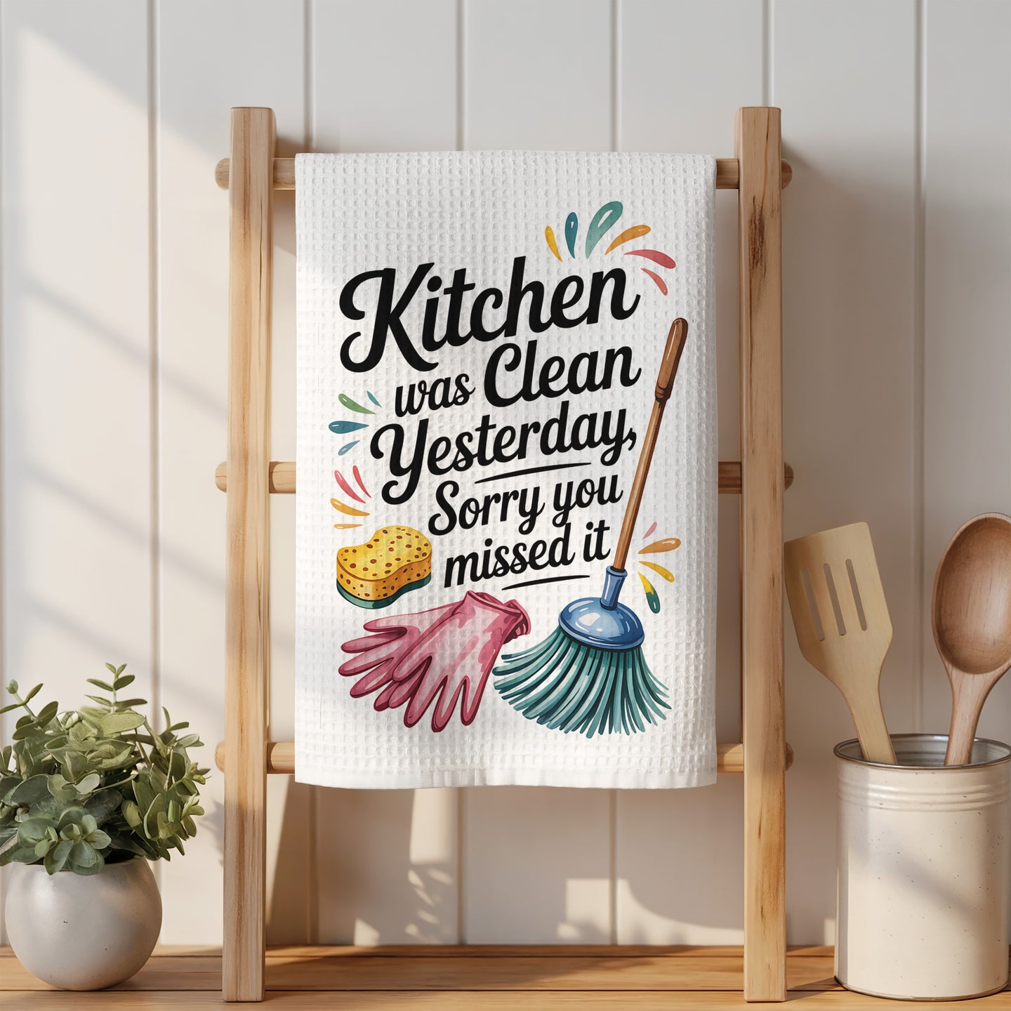 Kitchen towel with "Kitchen was clean yesterday, sorry you missed it" text and illustrations.
