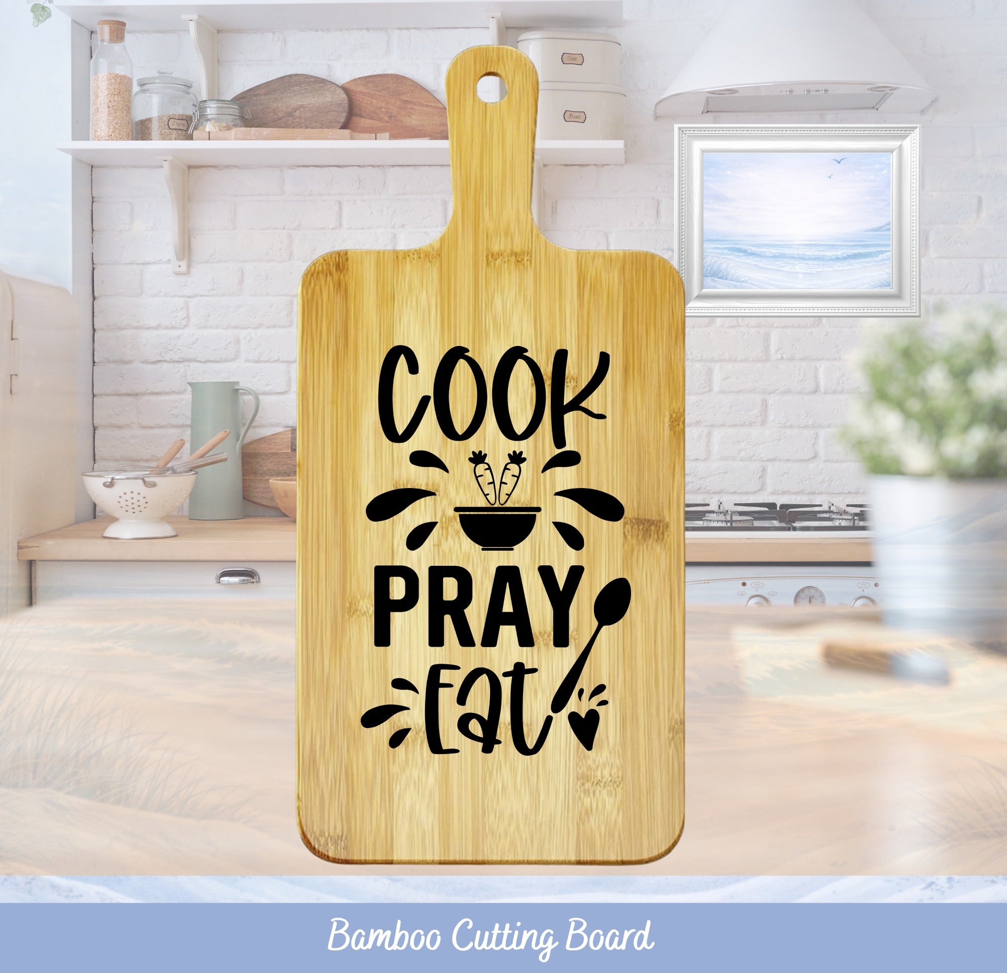 Bamboo cutting board with "Cook Pray Eat" text and kitchen background.