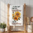 Sunflower art and quote "If you can't find the sunshine, be the sunshine" on a kitchen towel.