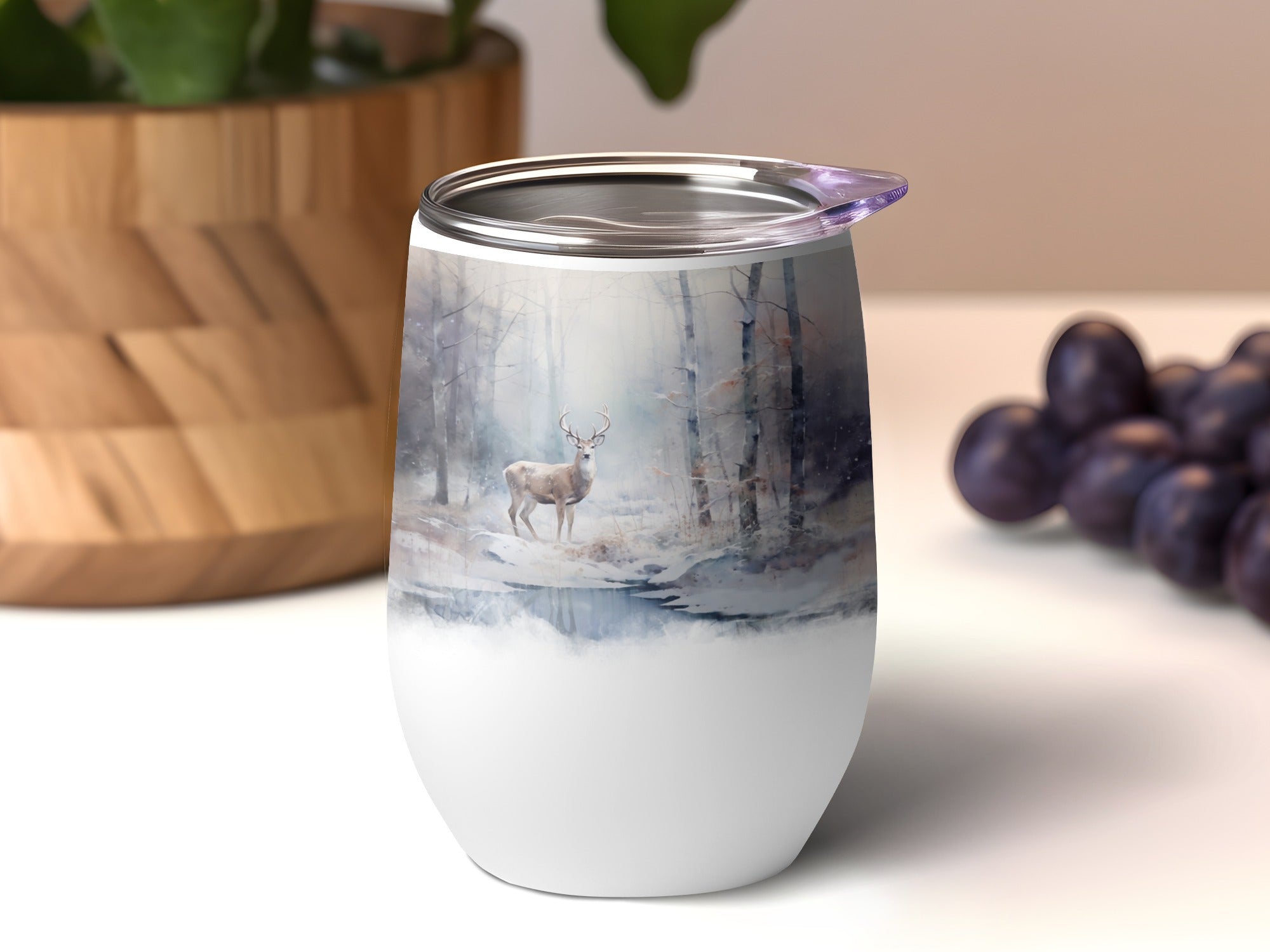 White stemless wine tumbler with winter forest and deer illustration.