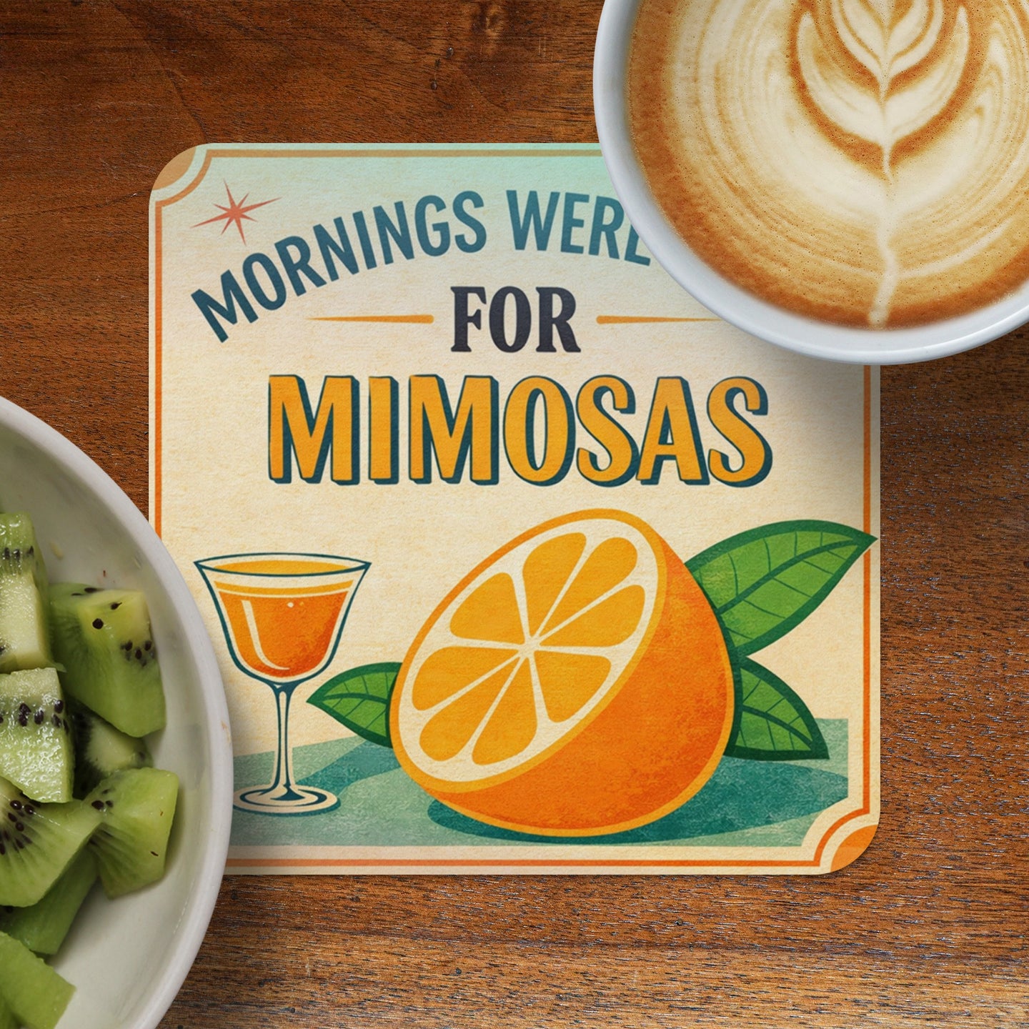Coaster with "Mornings Were For Mimosas" text, orange slice, and glass of juice.