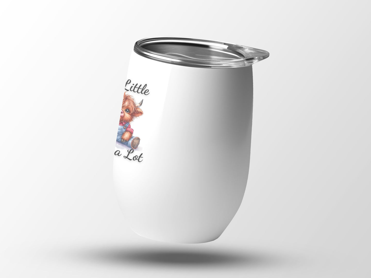 White tumbler with a cartoon highland cow wearing overalls.