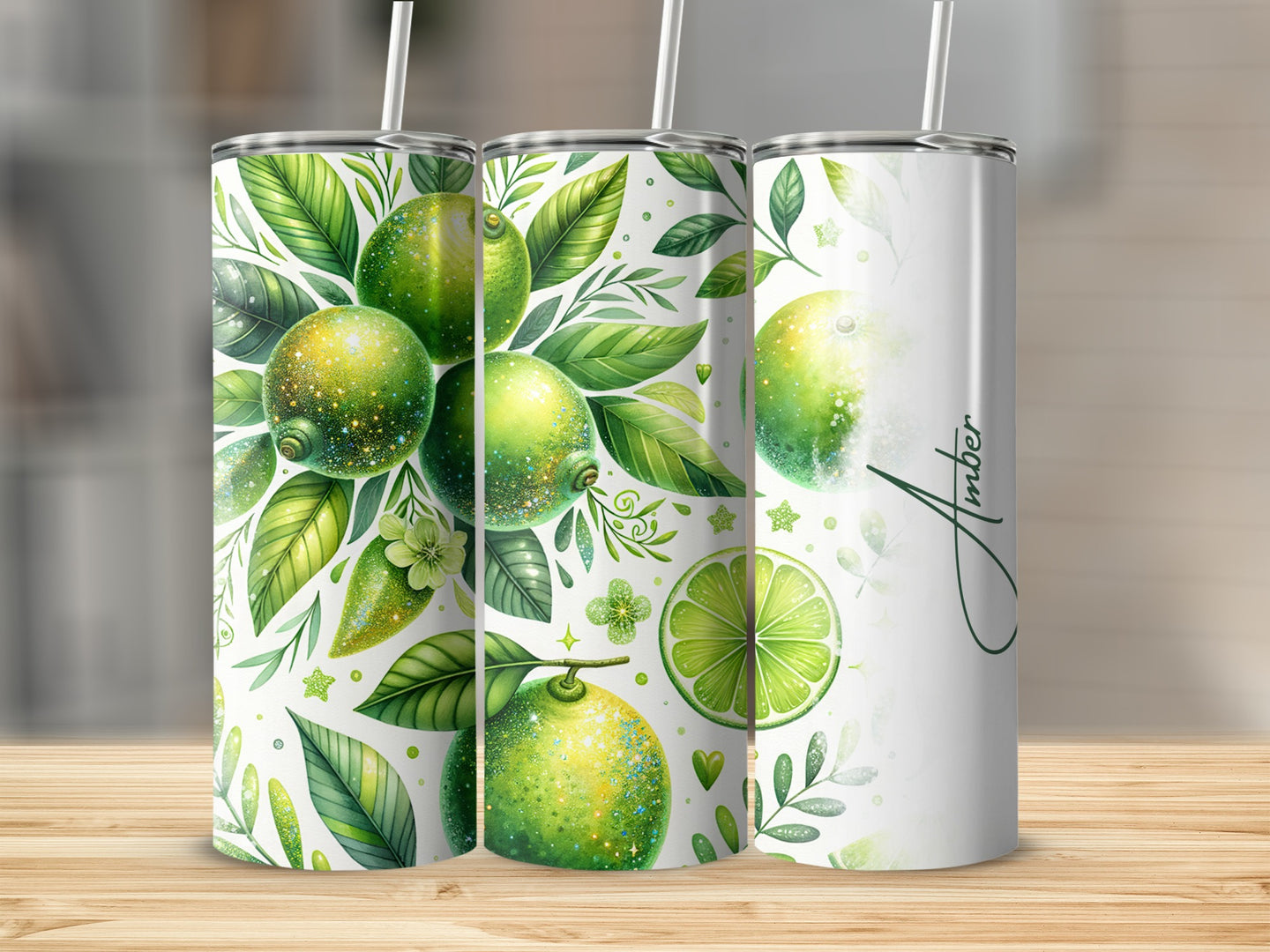 Three tall tumblers with green lime and leaf design.