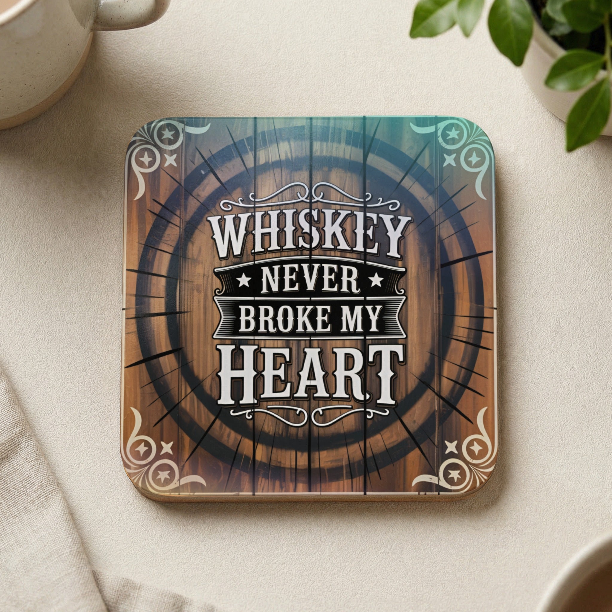 Coaster with "Whiskey Never Broke My Heart" text inside a barrel design.