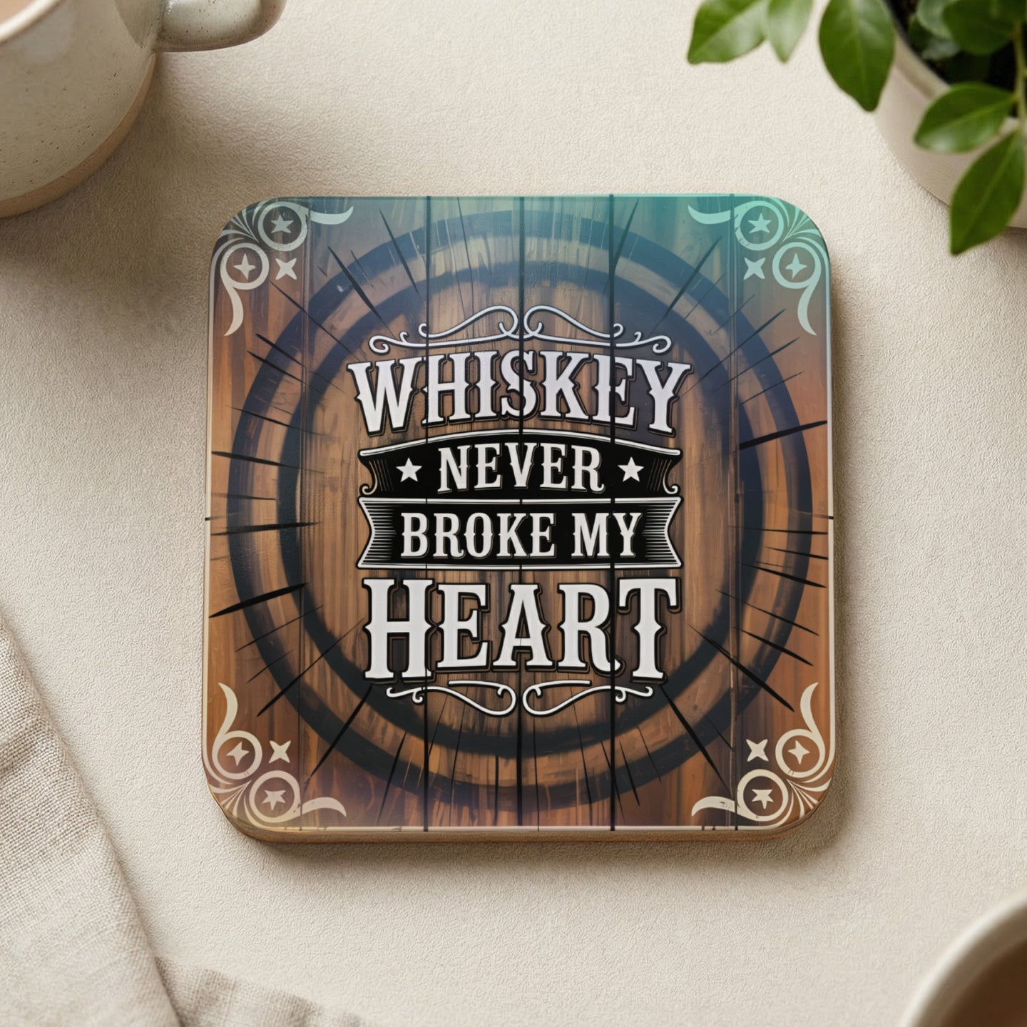 Coaster with "Whiskey Never Broke My Heart" text inside a barrel design.