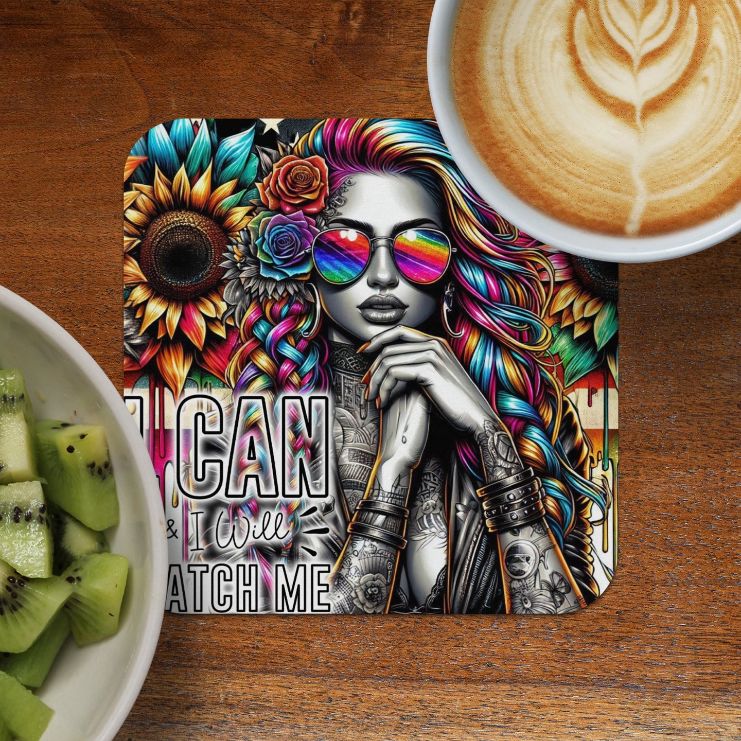 Woman with colorful hair and sunglasses on a coaster with floral background and text.