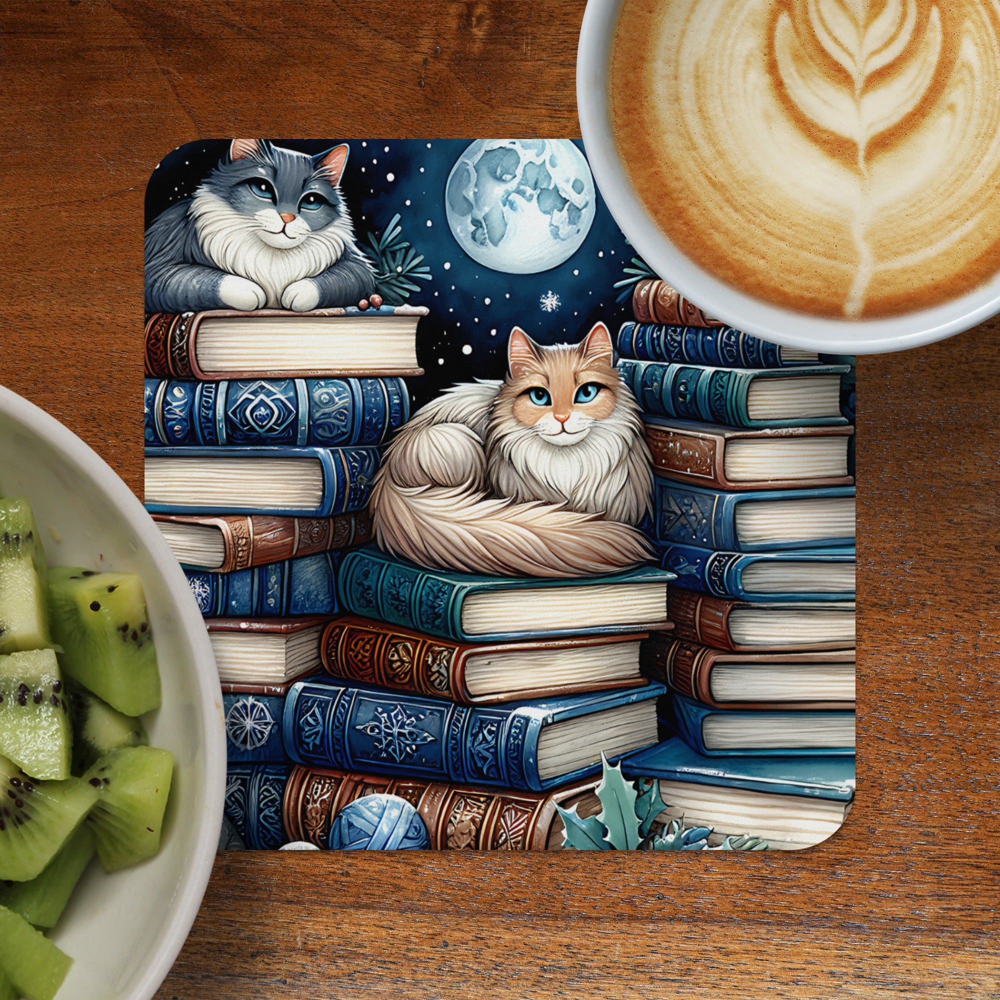 Two cats sit on a stack of books under a moonlit night sky.