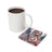 Square coaster with angel holding baby, "Peace Love" text, next to coffee mug.
