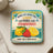 Coaster with lemons, strawberries, and text about vodka.