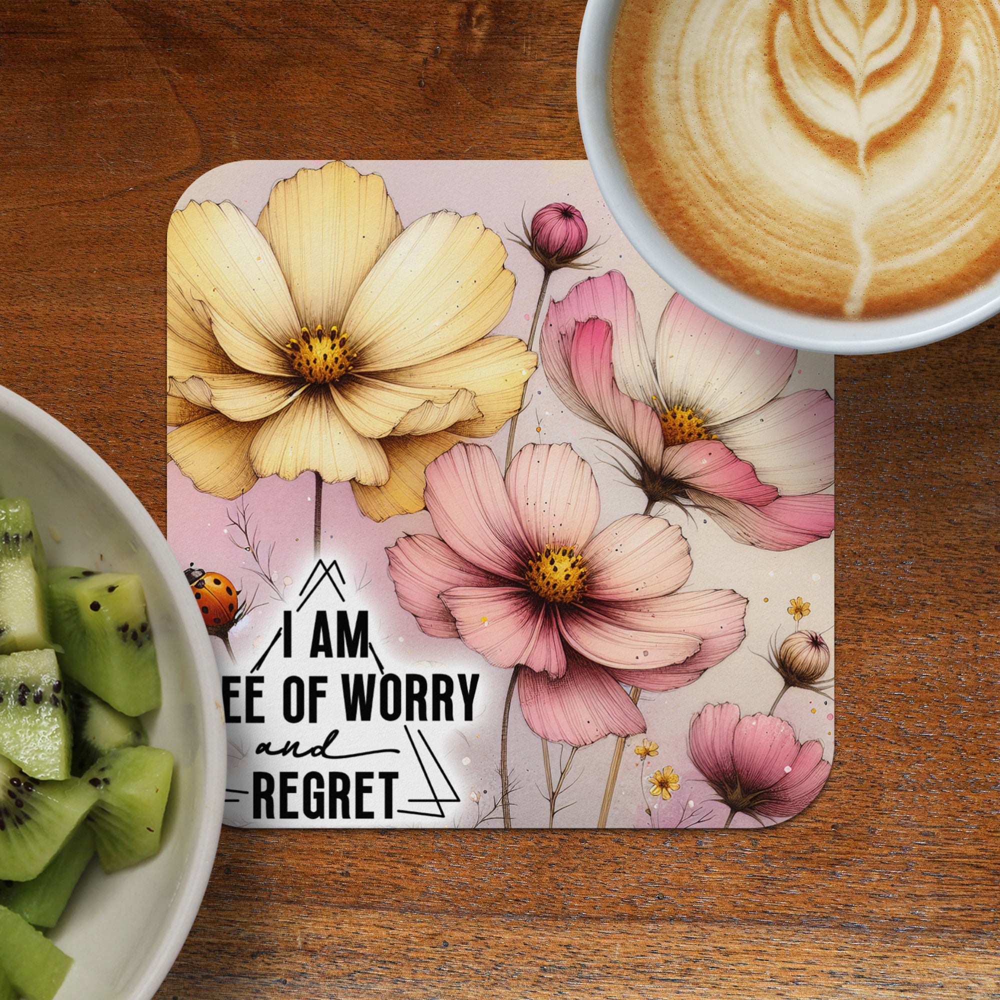 Coaster with pink and yellow cosmos flowers and text "I AM FREE OF WORRY AND REGRET".