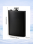 Black metal flask with dimensions 14cm tall and 9.3cm wide.