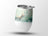 White tumbler with a painting of an orange kitten surrounded by butterflies and flowers.