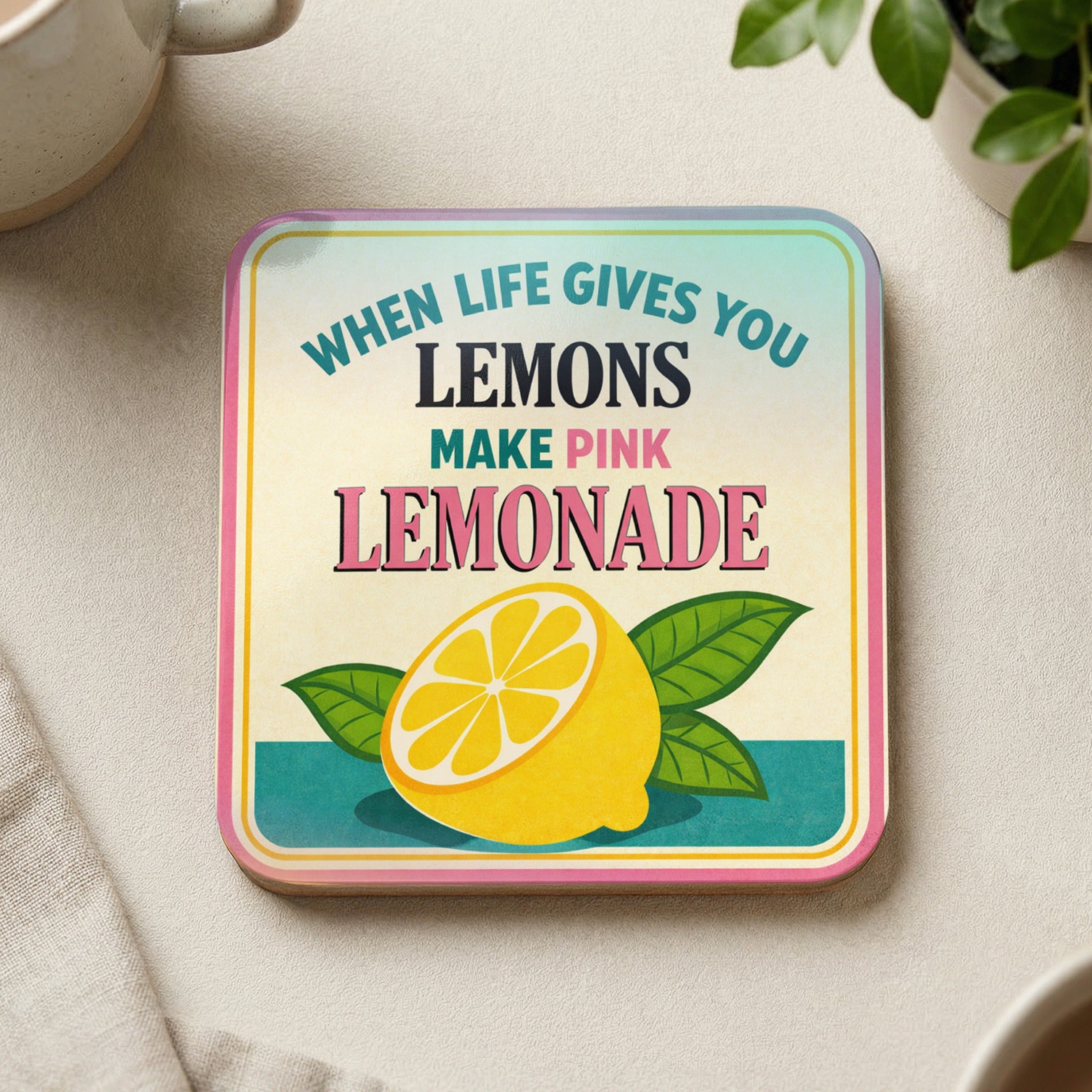 Square coaster with "When life gives you lemons make pink lemonade" text and a lemon graphic.