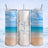 White glitter tumbler with "Amelia" text, beach scene.