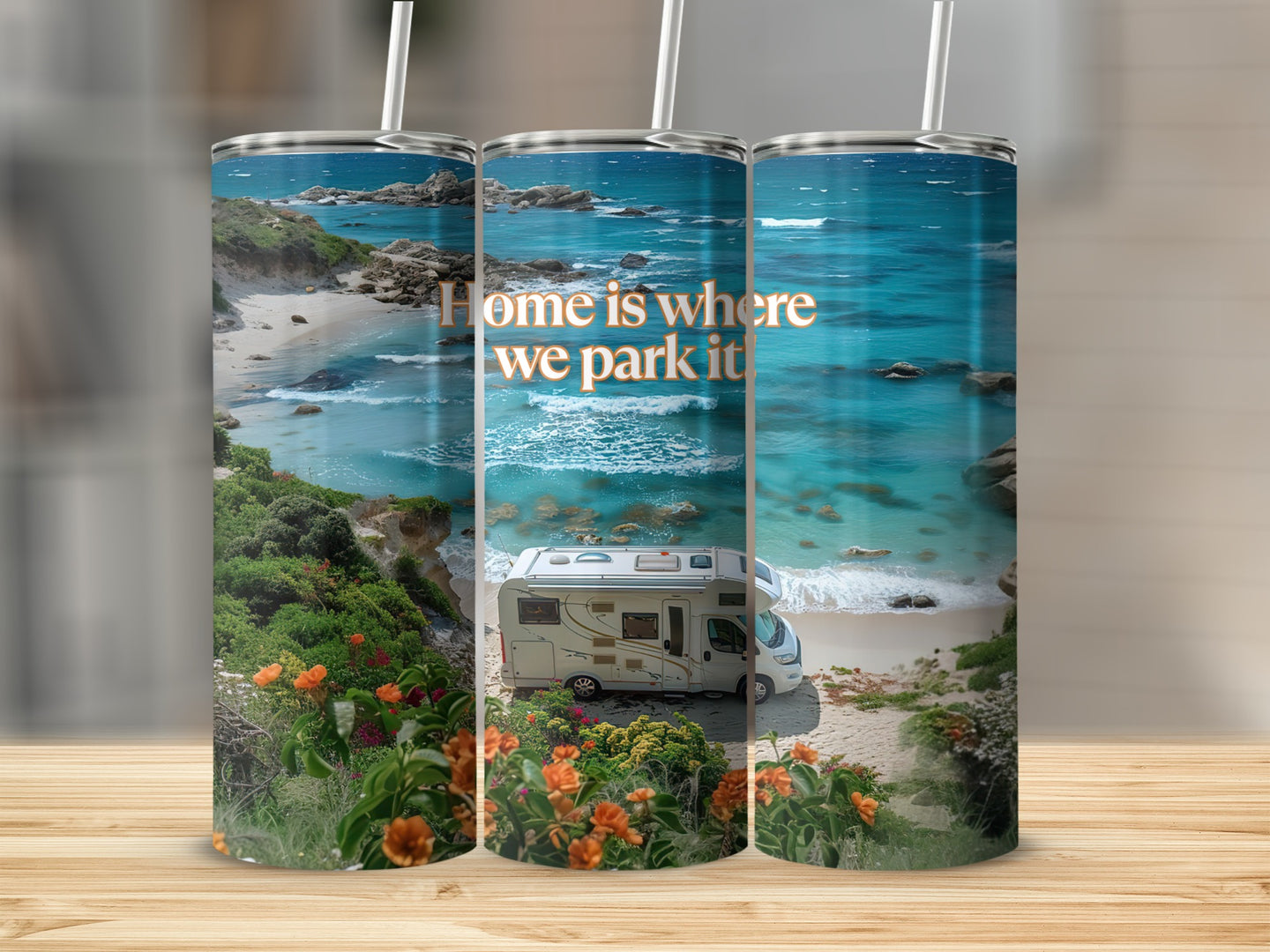Campervan parked on a beach with text "Home is where we park it".