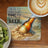 Coaster with beer bottle splashing in ocean waves and text "There is always time for another beer".