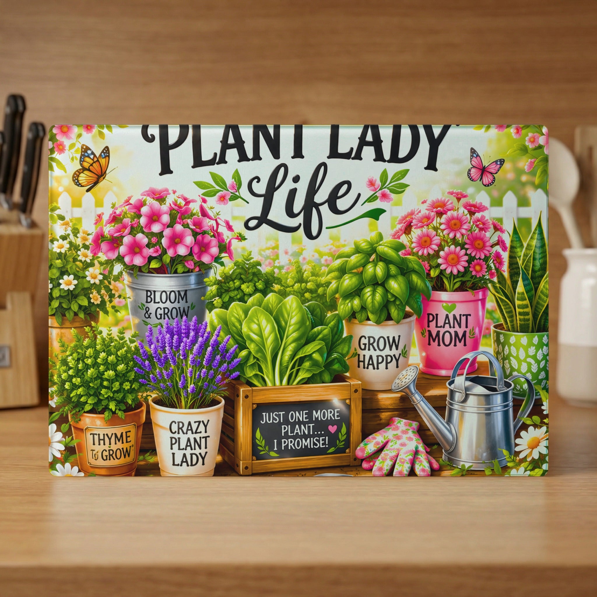 "Plant Lady Life" decorative cutting board with plants, watering can, and gloves.