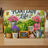 "Plant Lady Life" decorative cutting board with plants, watering can, and gloves.
