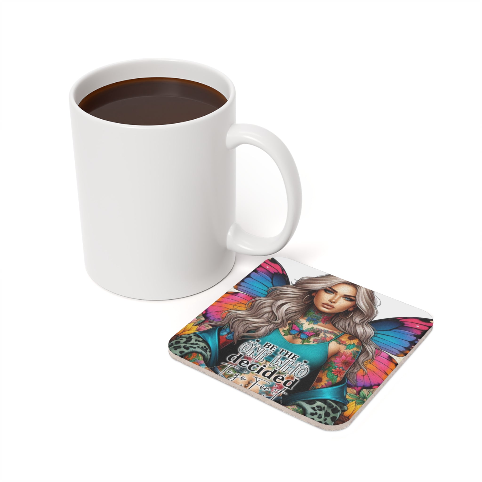 Woman with butterfly wings on coaster next to coffee mug.