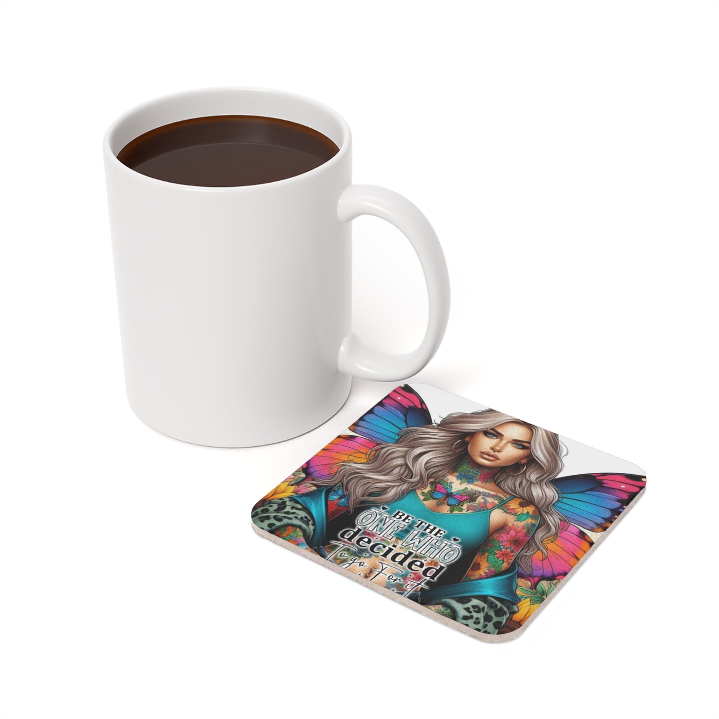Woman with butterfly wings on coaster next to coffee mug.