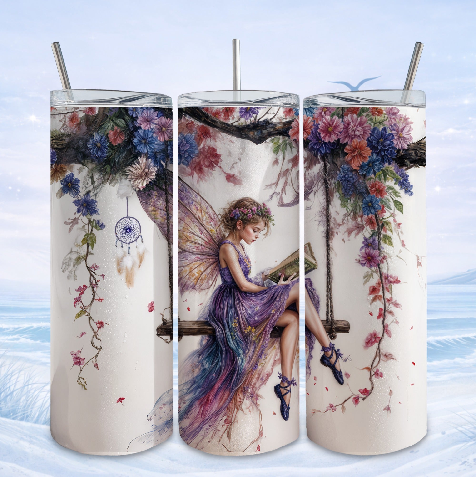 Fairy reading a book tumbler on a swing decorated with flowers and a dreamcatcher.