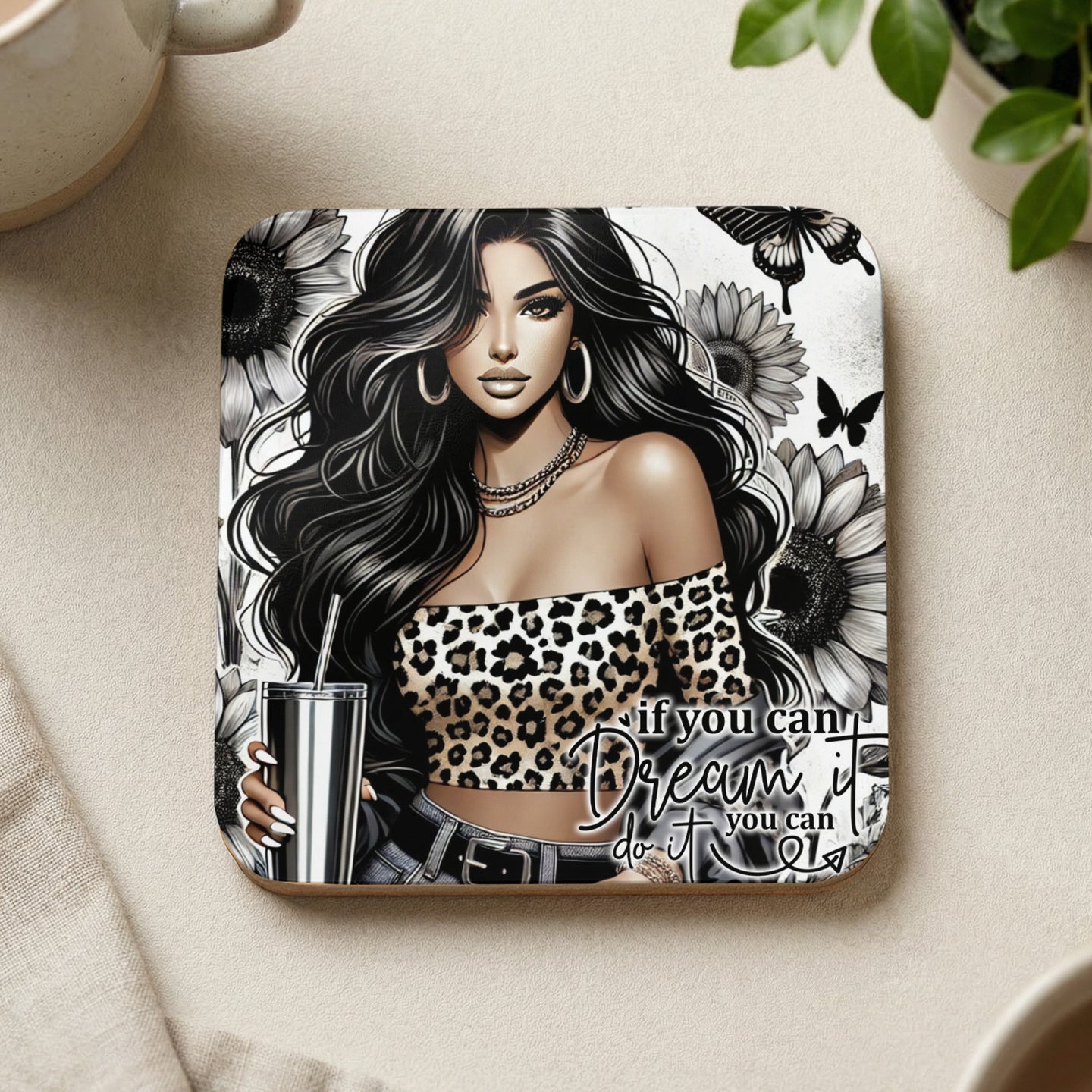 Woman in leopard print top holding cup, with sunflowers and butterflies design.