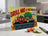 Cartoon vegetables "Grill Me If You Must! I'm Organic!" on a grill graphic.