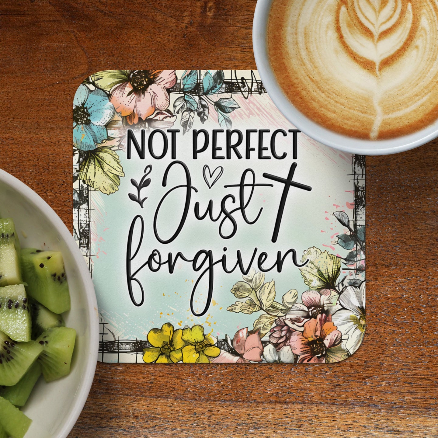 Coaster with "Not Perfect Just Forgiven" text and floral design.