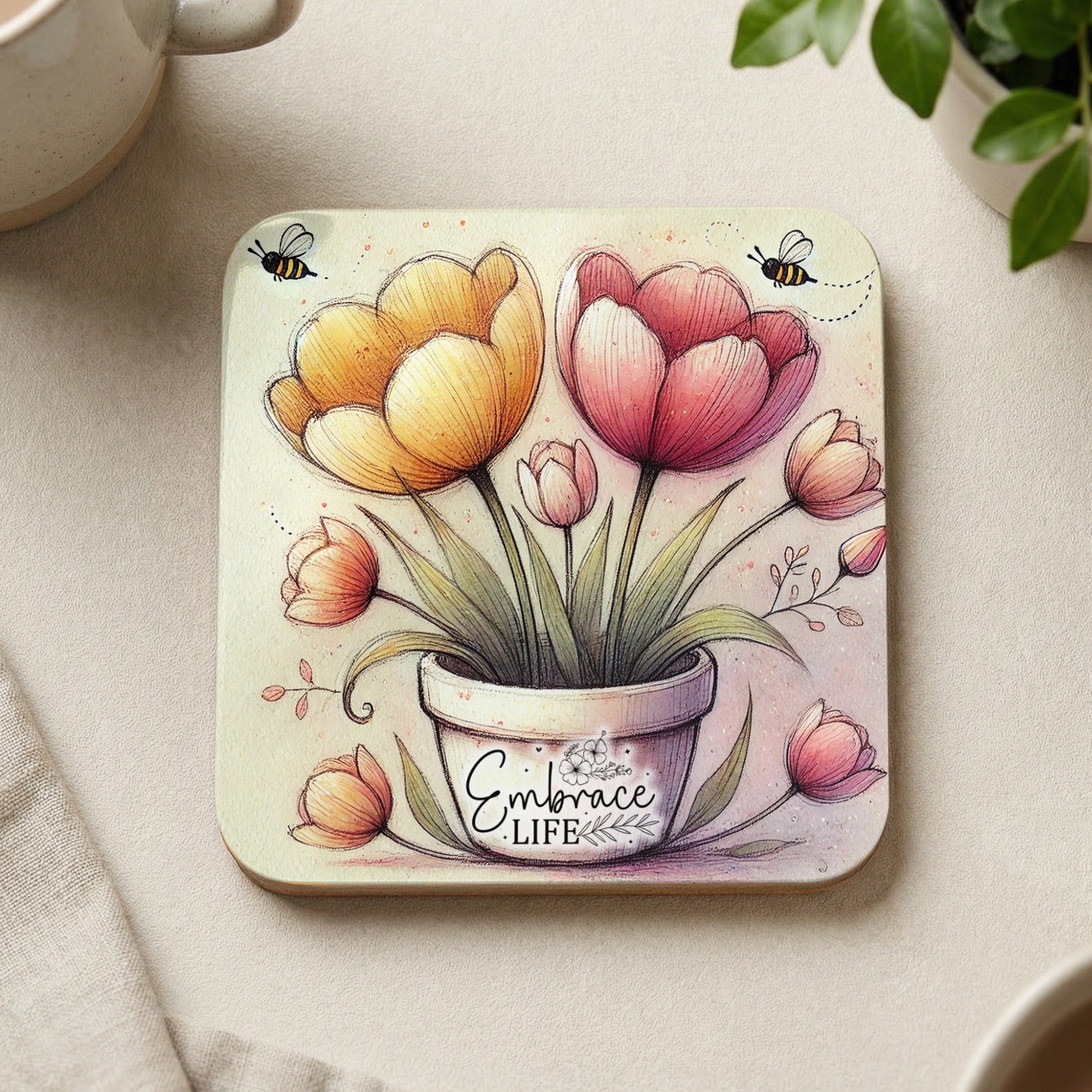 Square coaster with potted tulips, bees, and the text "Embrace Life".