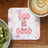Round coaster with "God is good all the time" text, coffee, and kiwi.