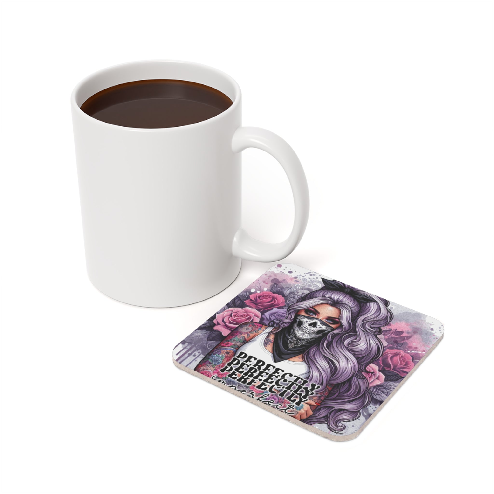 Square coaster with tattooed woman and roses, next to a mug of coffee.