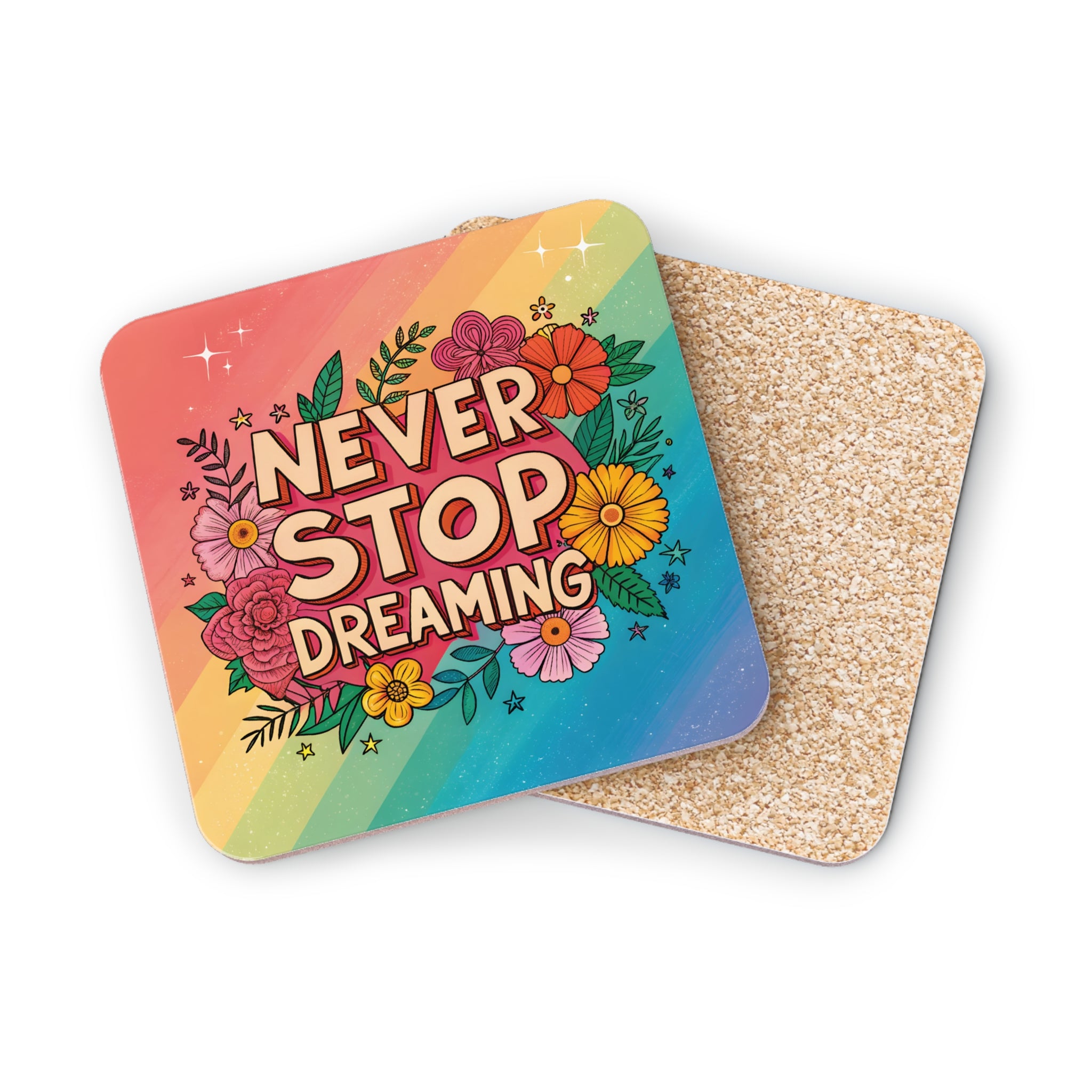Coaster with rainbow gradient and "NEVER STOP DREAMING" text surrounded by flowers.
