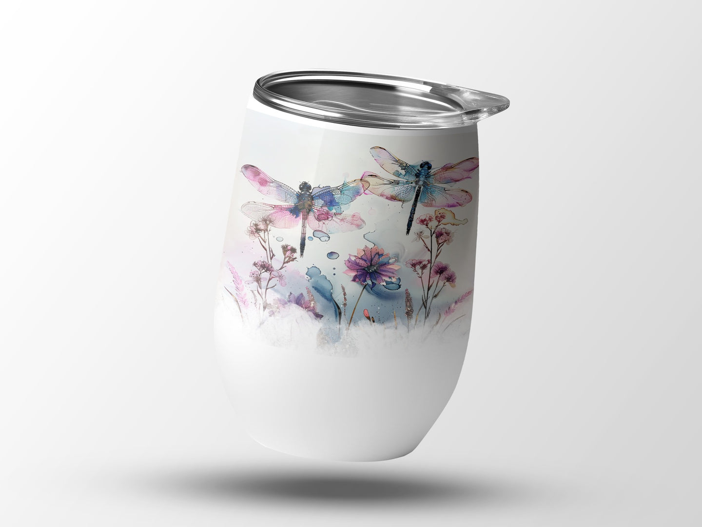 White tumbler with watercolor dragonflies and floral design.
