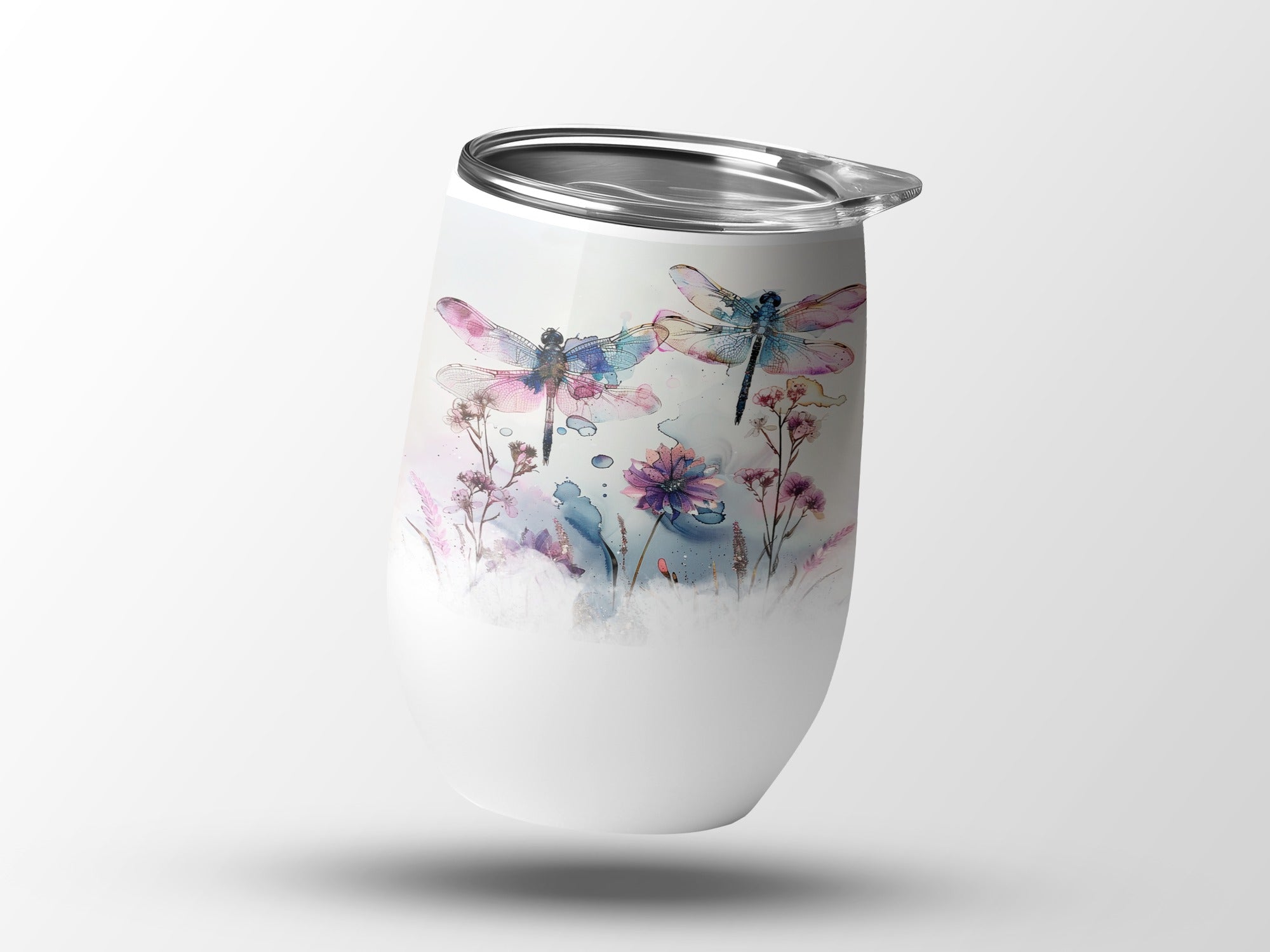 White tumbler with watercolor dragonflies and floral design.
