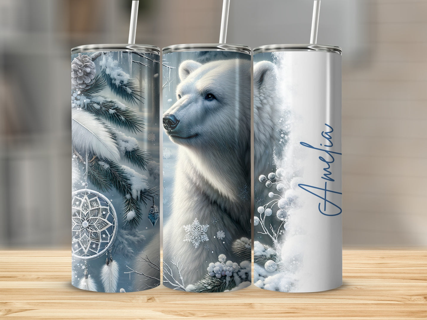 Polar bear and winter design on three tumblers, one with "Amelia" text.