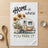 Camper trailer with sunflowers and "HOME is where YOU PARK IT" text.