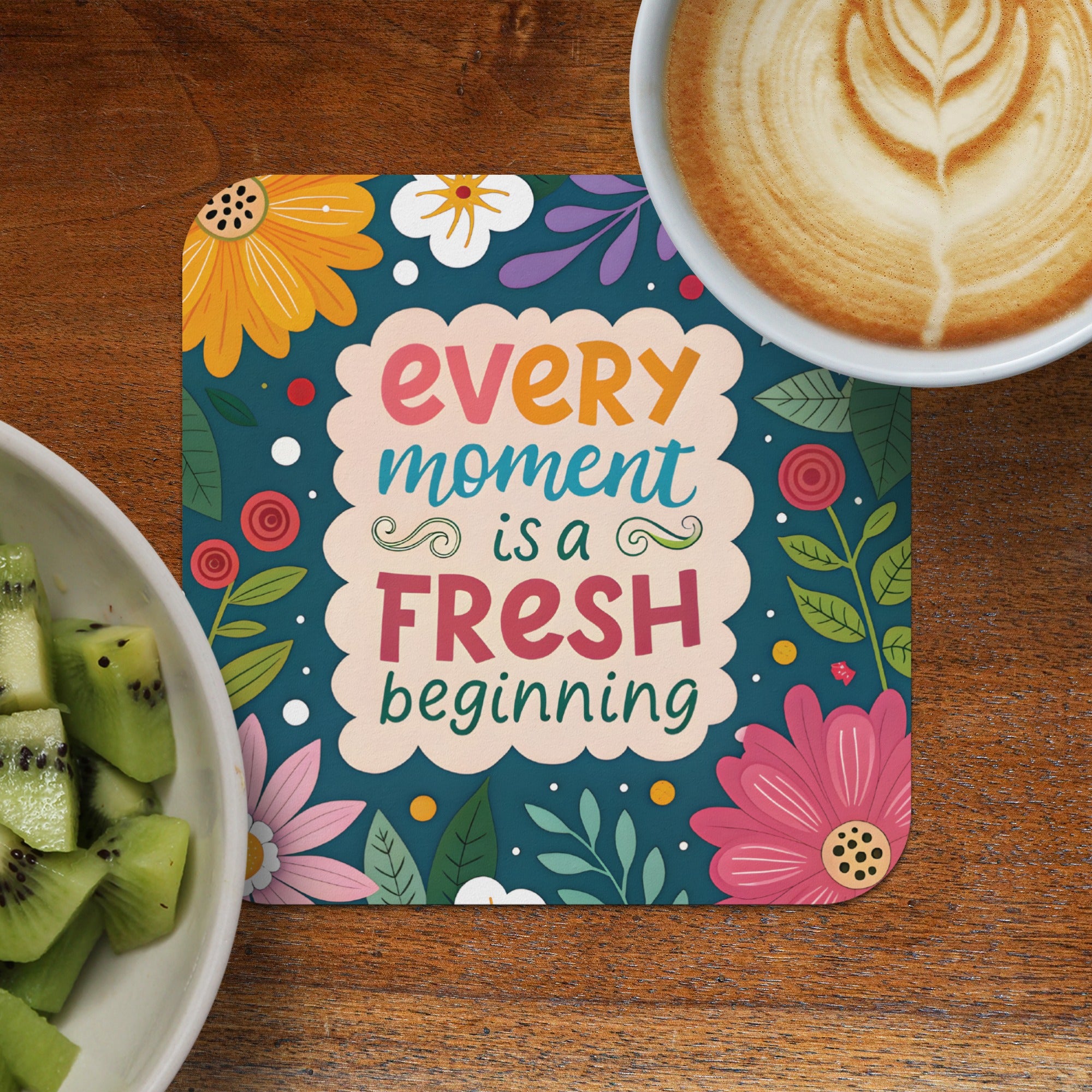 Coaster with "every moment is a fresh beginning" and floral design.