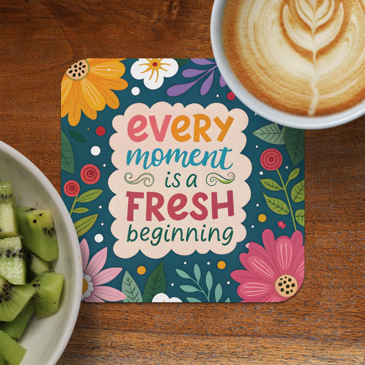 Coaster with "every moment is a fresh beginning" and floral design.