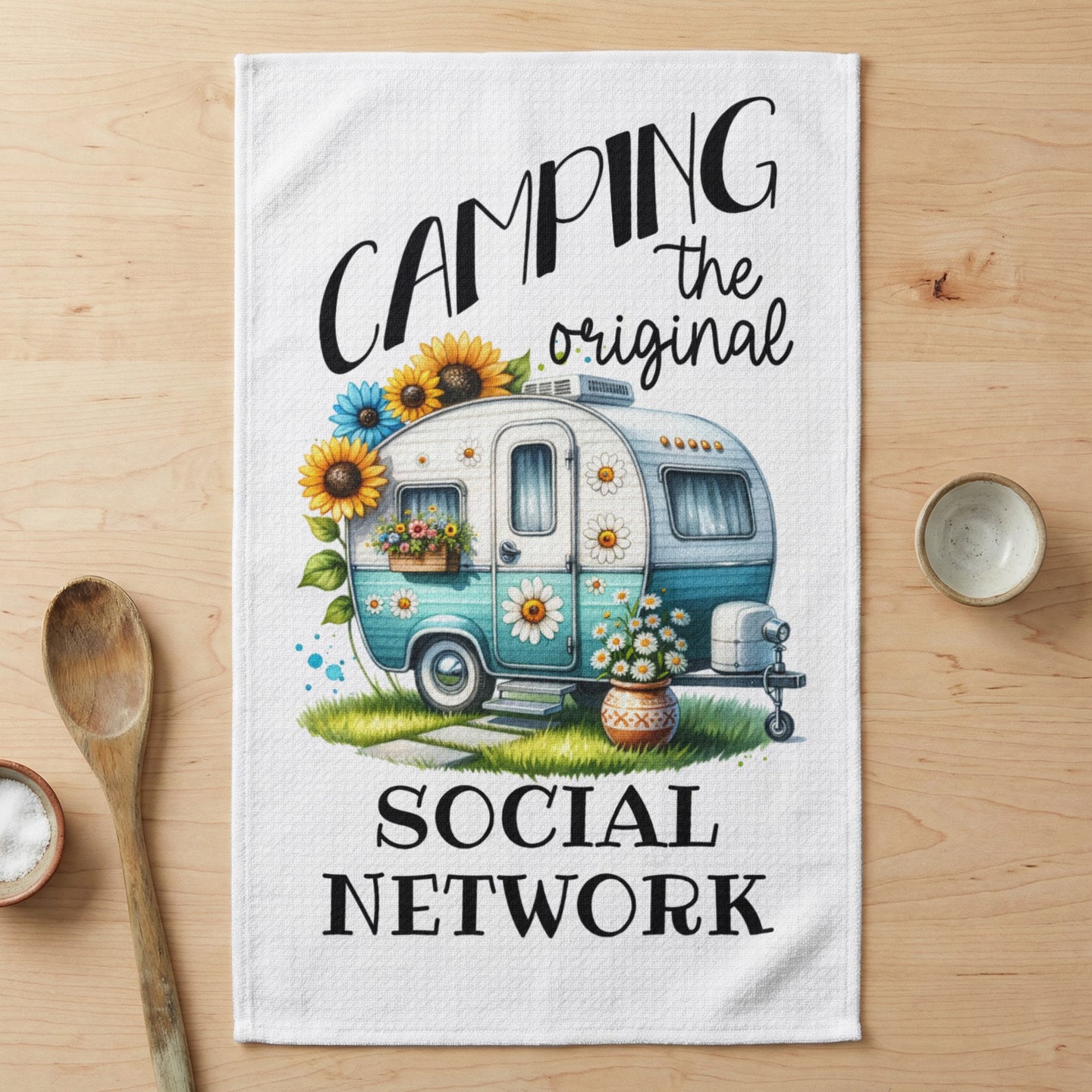 Teal camper with sunflowers and text "Camping the original social network".