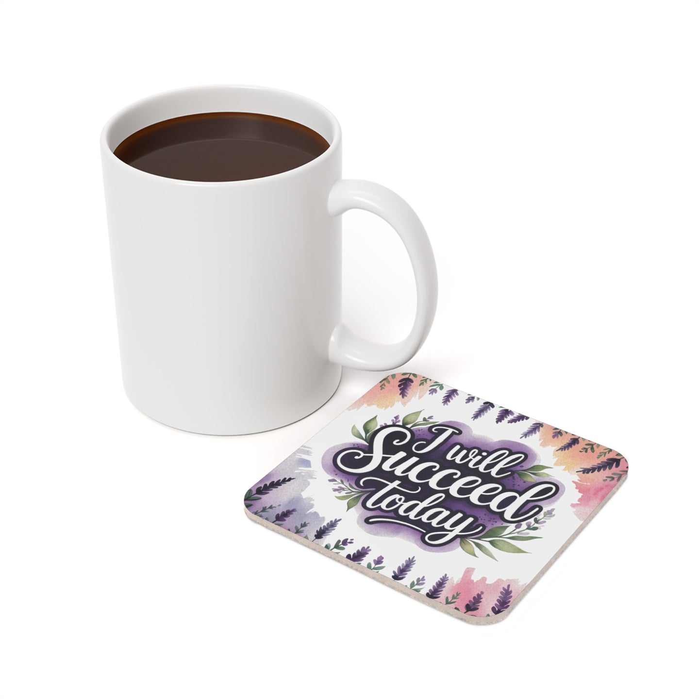 White mug of coffee beside square coaster with lavender floral design and text "I will succeed today."