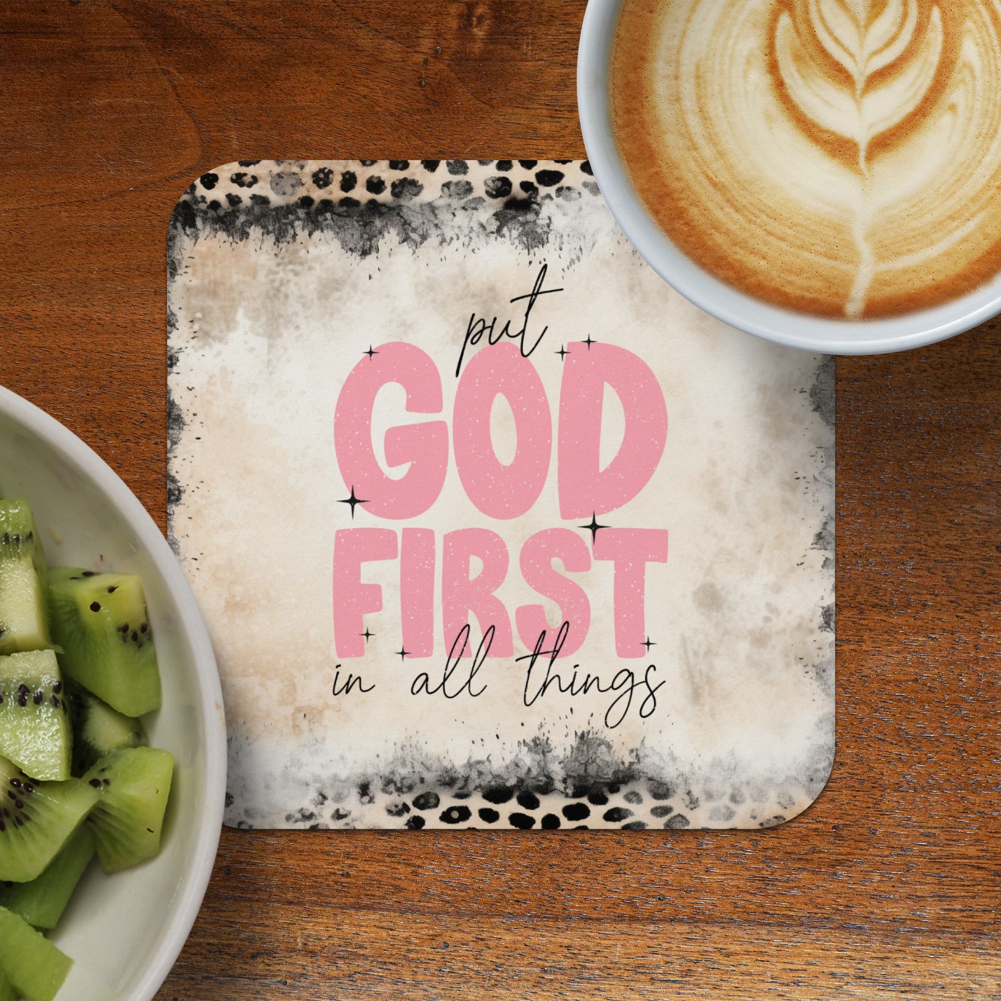 Coaster with "put GOD FIRST in all things" text and latte art coffee and kiwi.
