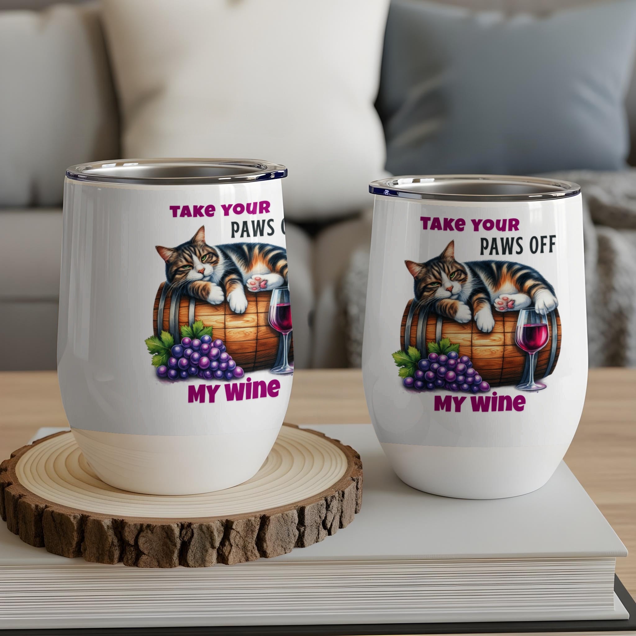 Two wine tumblers with a cat on a barrel and grapes graphic.