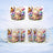 Happy Birthday cake with butterflies and balloons on a mug.