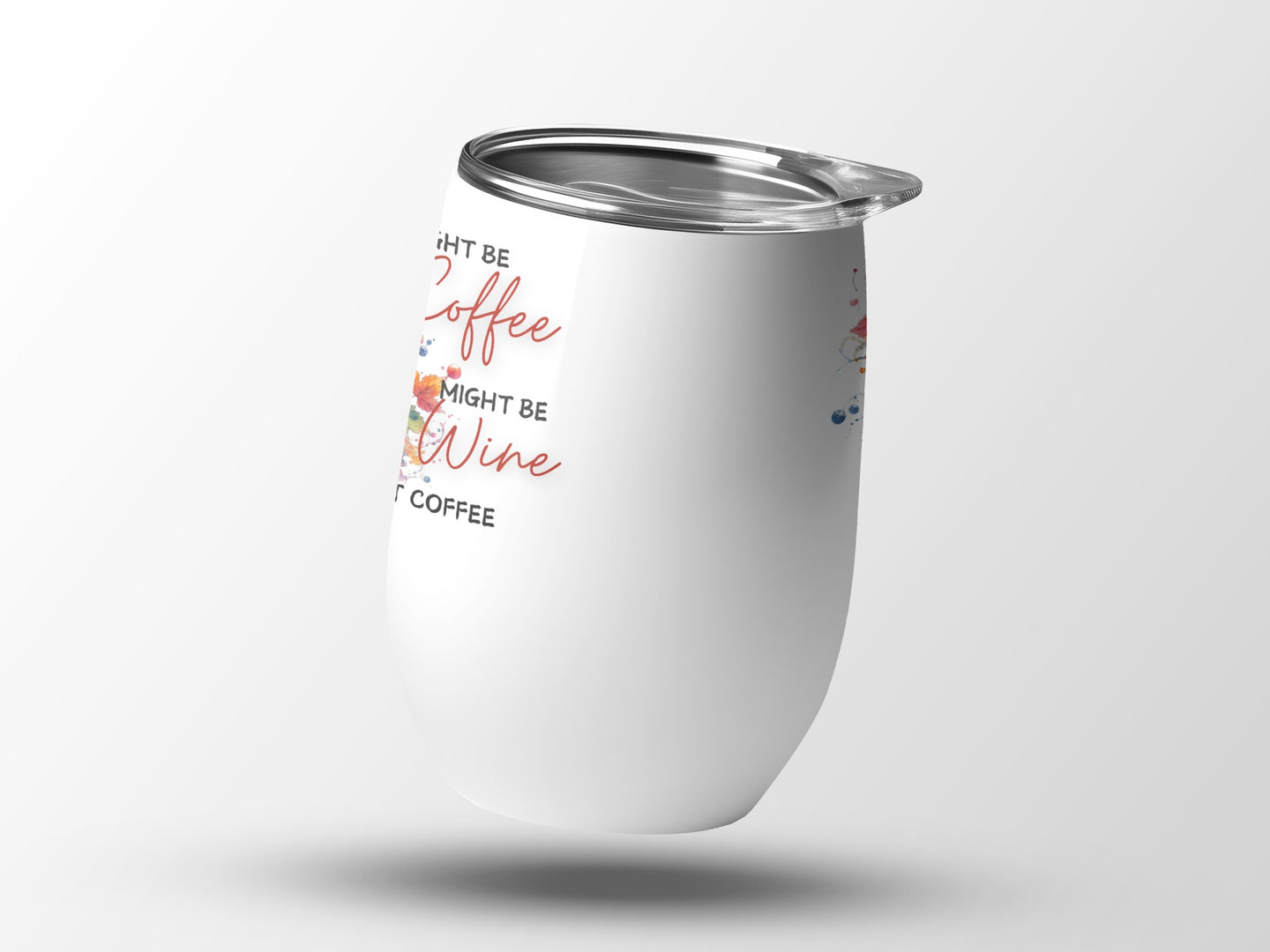 White tumbler with "Coffee Might Be My Coffee" text and abstract design.