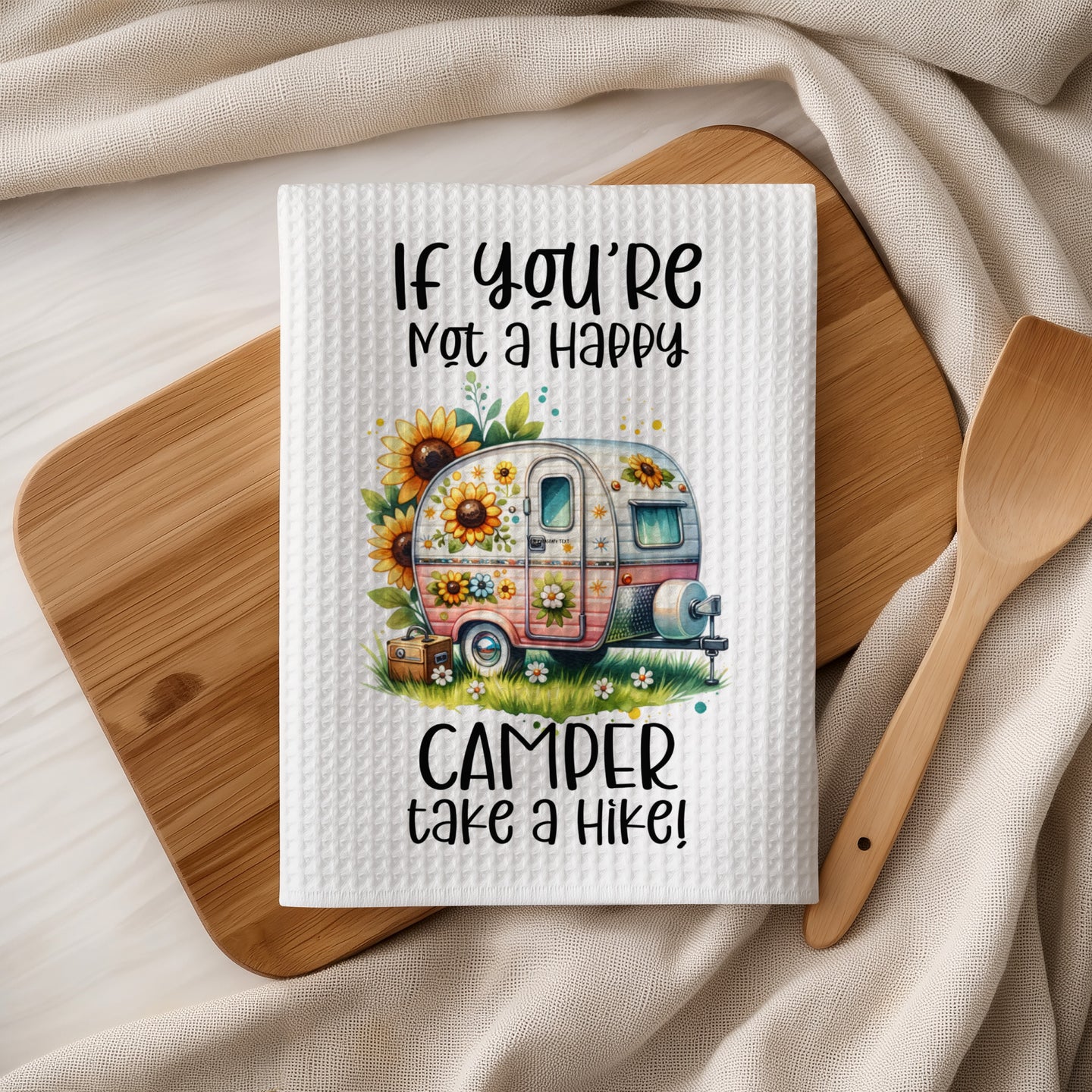 Camper and sunflowers with text "If you're not a happy camper take a hike!"