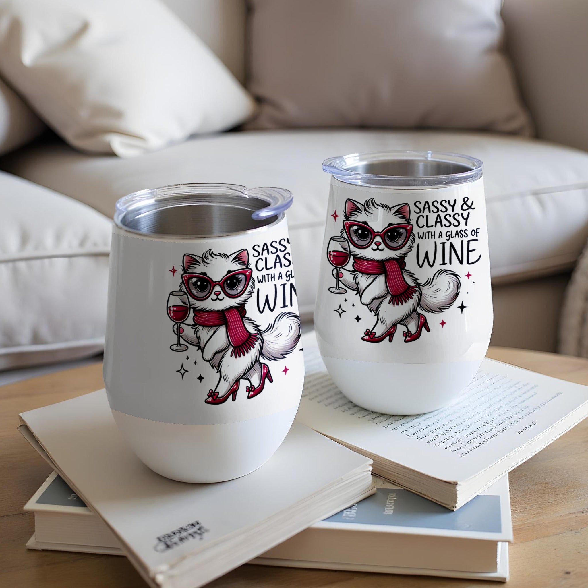 Two white tumblers with a sassy cat graphic and text "SASSY & CLASSY WITH A GLASS OF WINE".