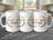 Three white ceramic mugs with "BEST DAD EVER" in gold laurel wreath.