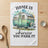 Green camper trailer with "HOME IS wherever YOU PARK IT" text.