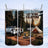 Three tumblers show a camping scene with a camper, tent, and fire pit.